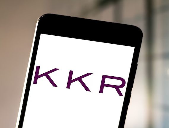 Smartphone with the KKR logo on the screen.