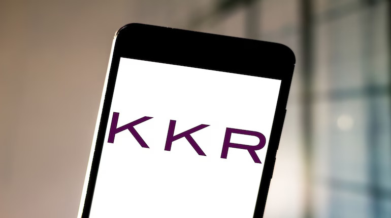 Smartphone with the KKR logo on the screen.